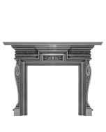 A black cast iron fireplace surround with a curved shaped frame and plant indentations