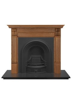 A black cast iron fireplace insert, an arched fireplace insert with a black bulbous fireplace arch, gas fire insert