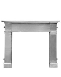 A fully poslished cast iron fireplace surround with a broad mantel and square shaped frame